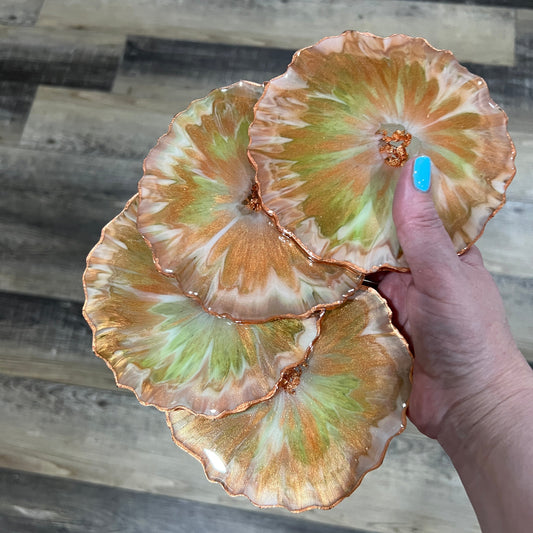 Set of four green and copper resin coasters with metallic leaf edges